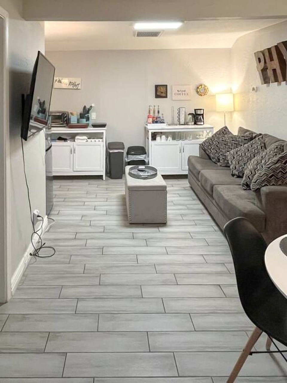 Full view of the main space - including the Living, Dining, and Kitchenette areas. Couch folds out into a couch bed or a queen blow up mattress can be used for extra capacity.