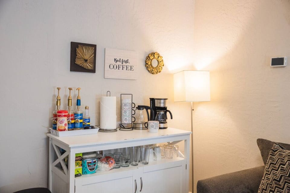The Kitchenette includes coffee pot, tea kettle, coffee syrups, cups, paper towels, coffee, tea, and a variety of other dishware!