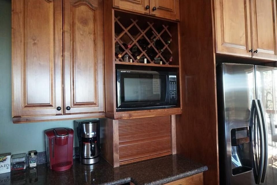 Coffee station w/ Keurig & Coffee pot. Microwave. Bread box w/ toaster inside