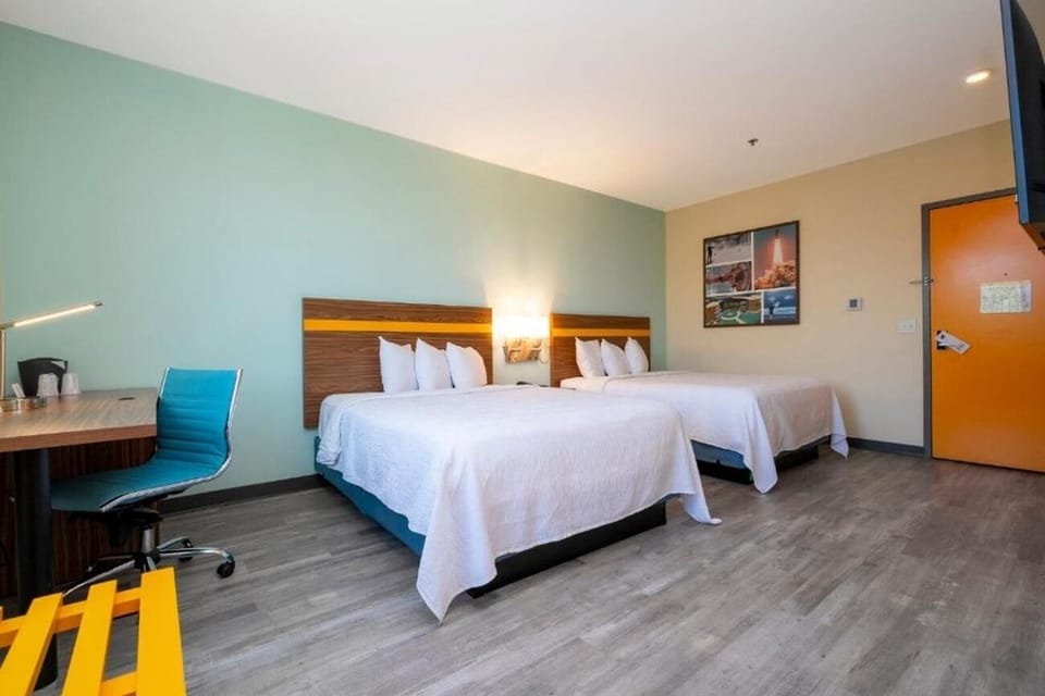 Stretch out in a spacious double-queen room with modern comfort.