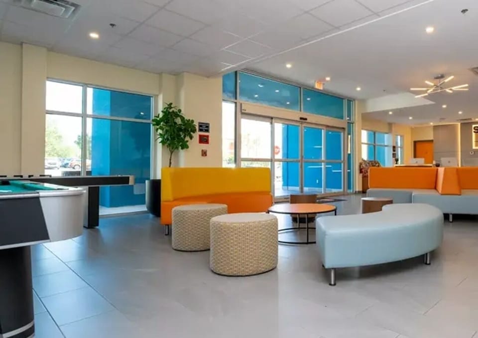 Arrive and unwind in a bright, modern lobby lounge.