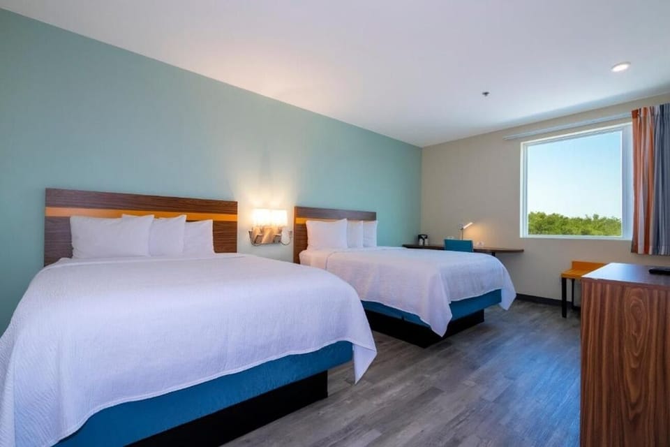 Unwind in a bright double-queen room with calming views.