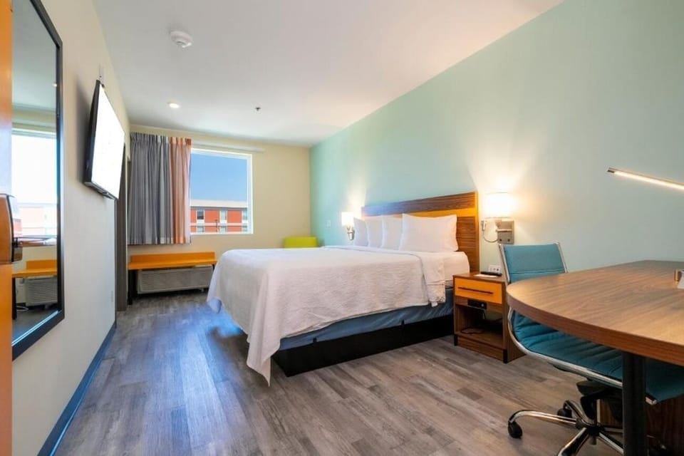 Wake up to natural light in this airy, modern room.