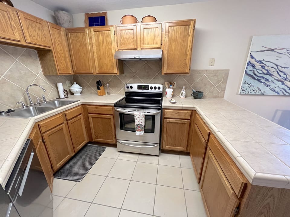 New appliances and generous counter space and cabinets in kitchen.