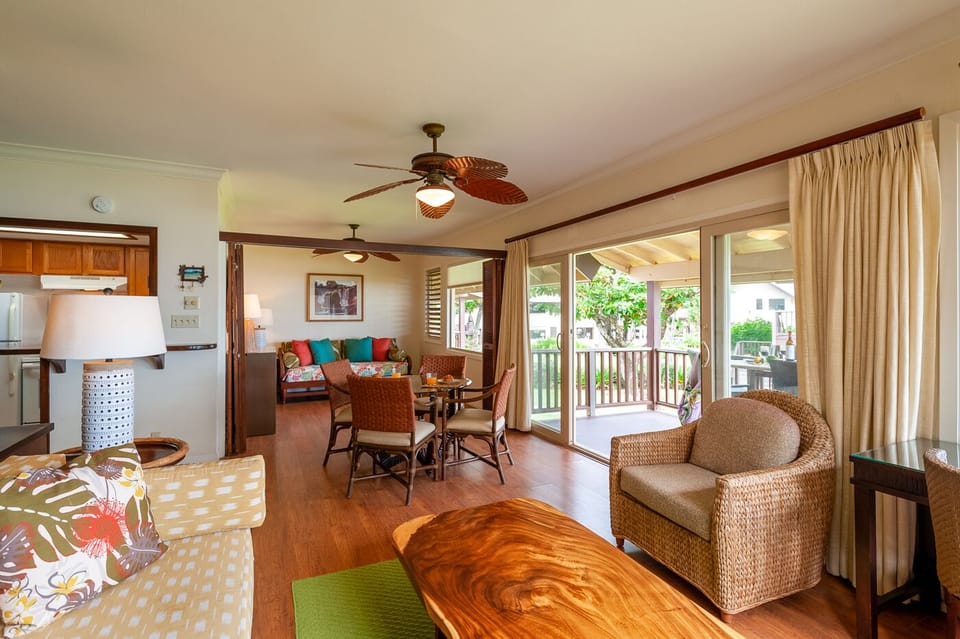 The living and dining areas open up onto the large lanai. Leave the screen door open to let in the breezes, or simply enjoy the view while you eat a meal!