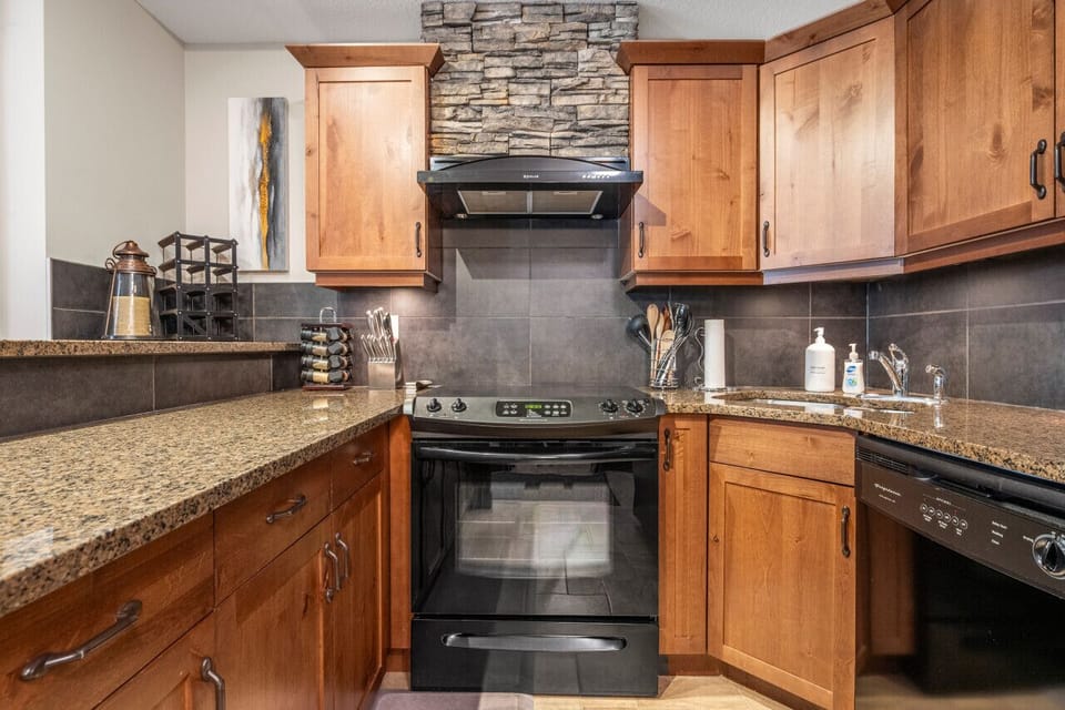 Full kitchen with a drip coffee machine, ground coffee, tea, sugar and basic condiments (ketchup, mustard and relish.)
