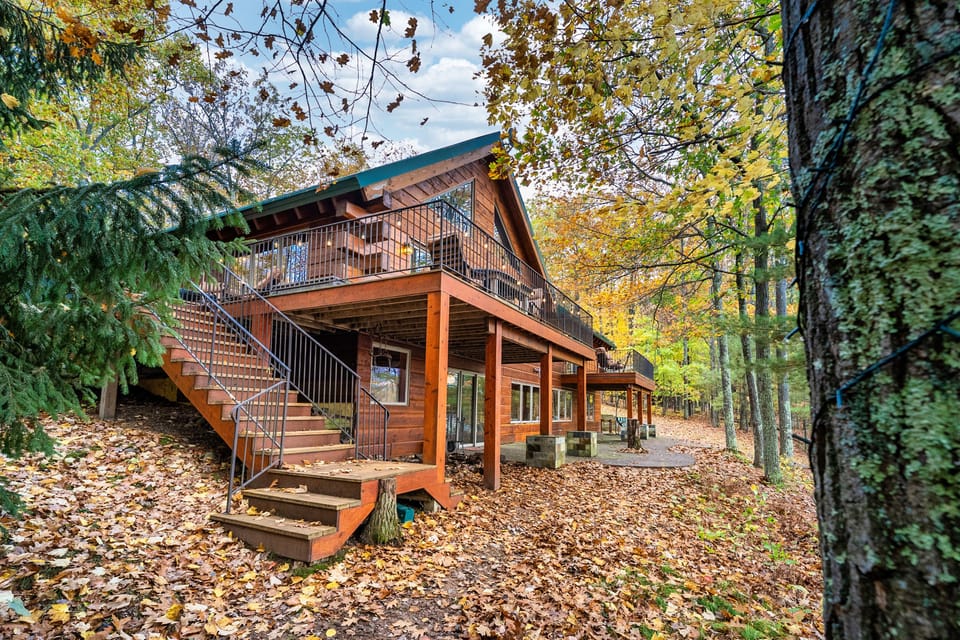 Staircase leading to the wrap around deck with access to the great room.