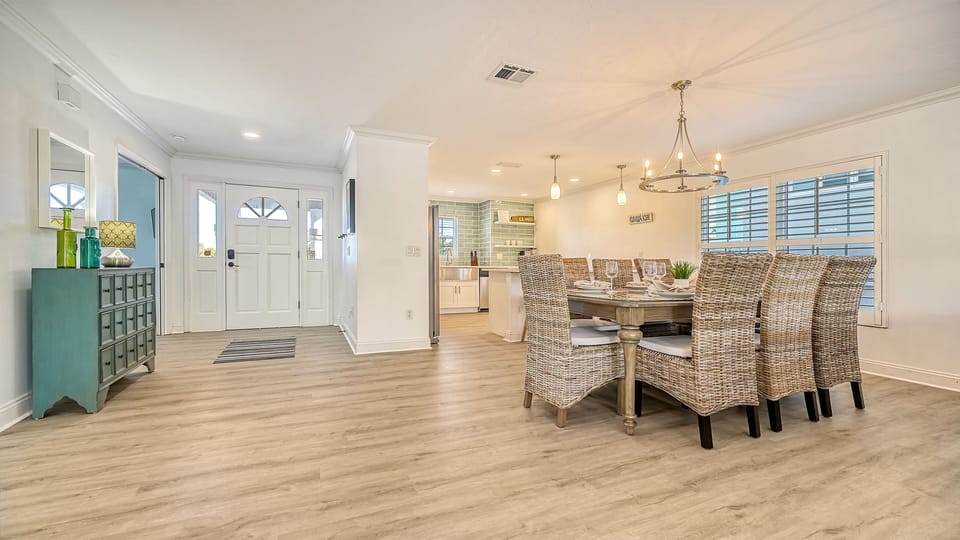 Open-concept living room with plush seating for gathering after a beach day.