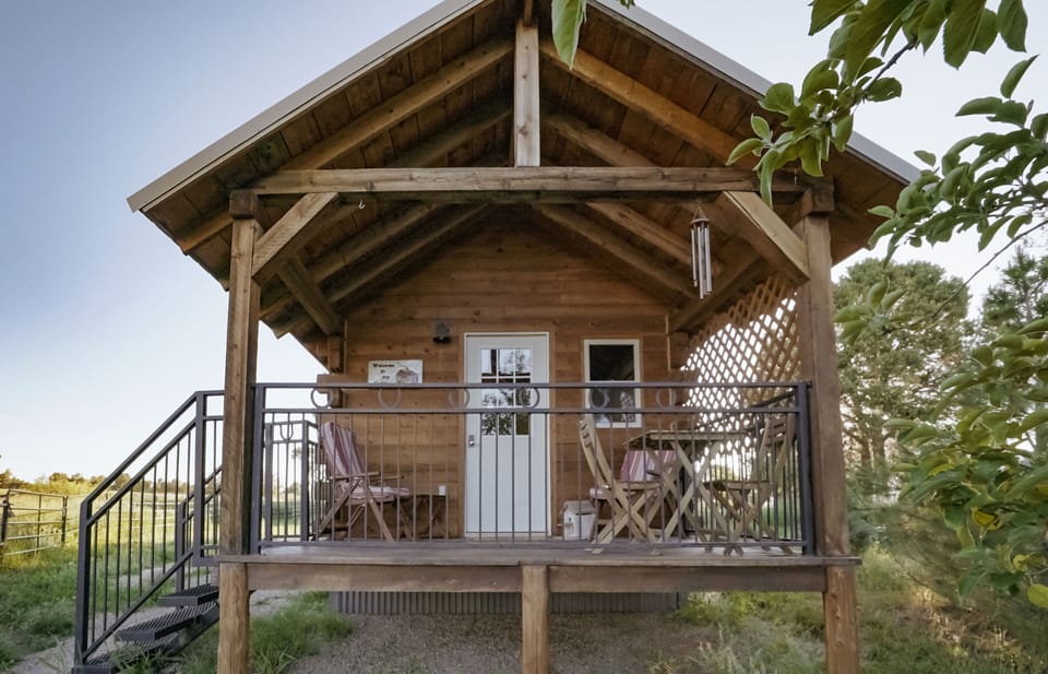 Tiny cabin with spacious porch, borders on acres of cow pasture