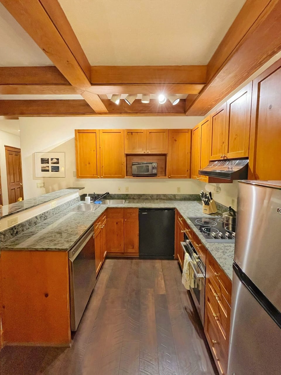 Large kitchen has new convection oven, dishwasher, and small fridge w/ice maker.