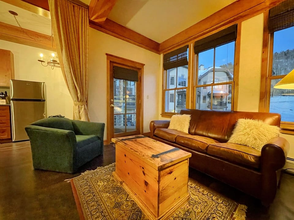 Additional view of living room and door to small balcony. 