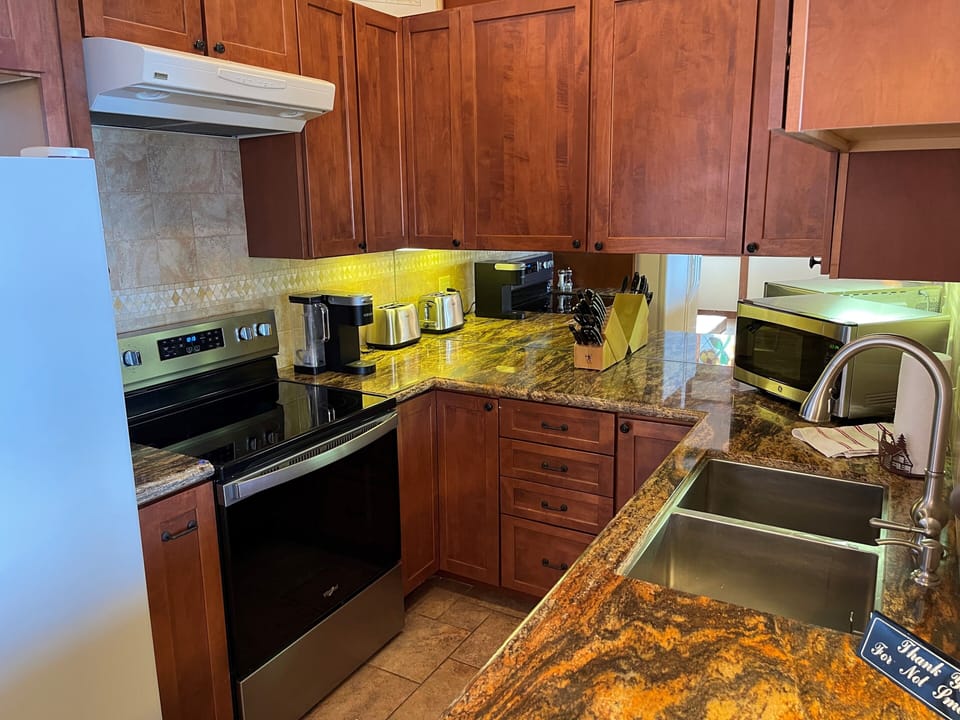 Kitchen with all new appliances and new dishes, pots pans etc