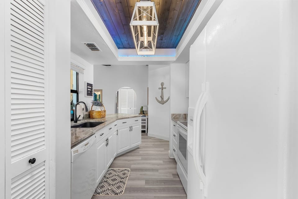 Very cool ceiling in beautiful kitchen with a lot of counter space
