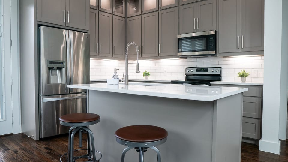 Additional seating can be found on the kitchen island which seats 2.