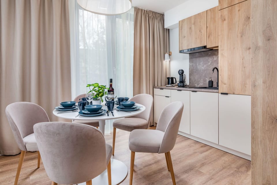 Kitchenette with sishwasher and refrigerator. 
