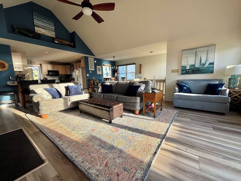 Spacious family room with cathedral ceiling.