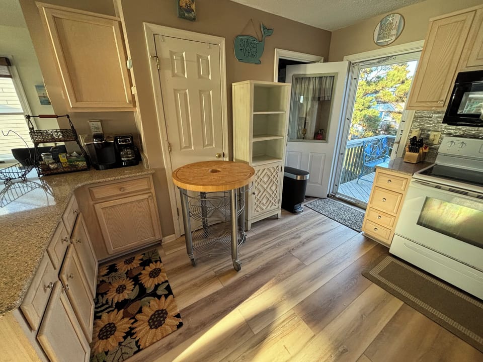 Rolling island, storage cabinet for guest’s food, keurig & 12 cup coffee maker.