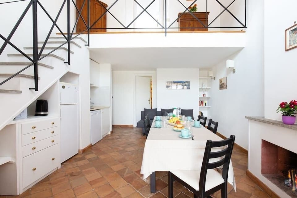 Lovely and bright living area with fully equipped kitchen, dining table, fireplace and double sofa bed