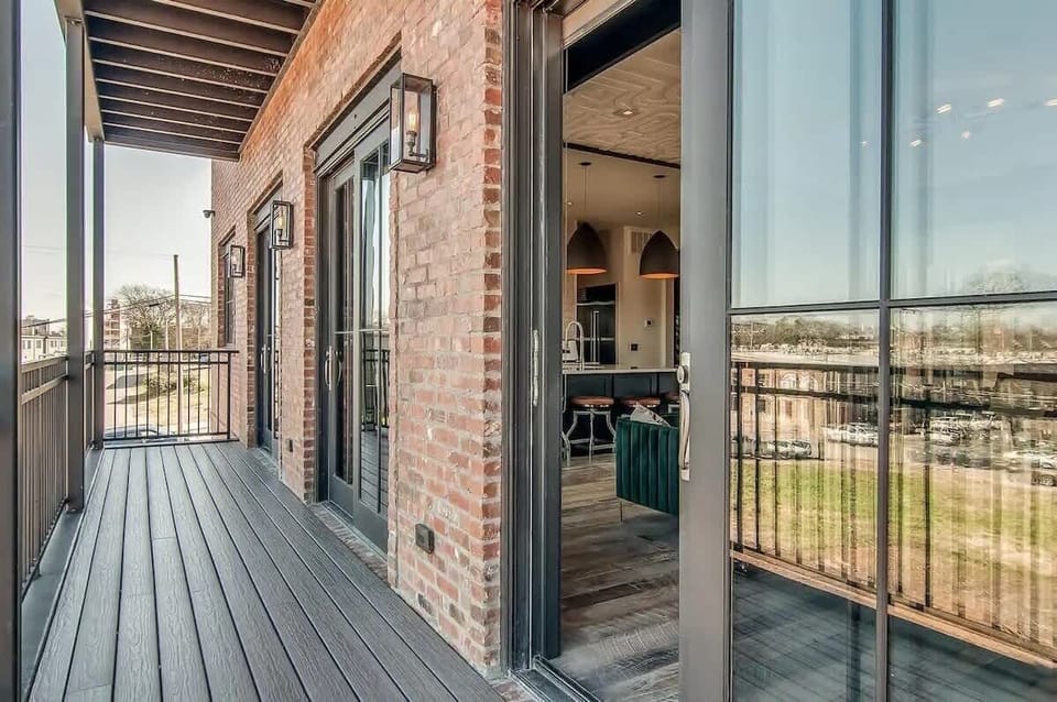 Home 1 - Enjoy fresh air and views from the balcony off the living and kitchen area.