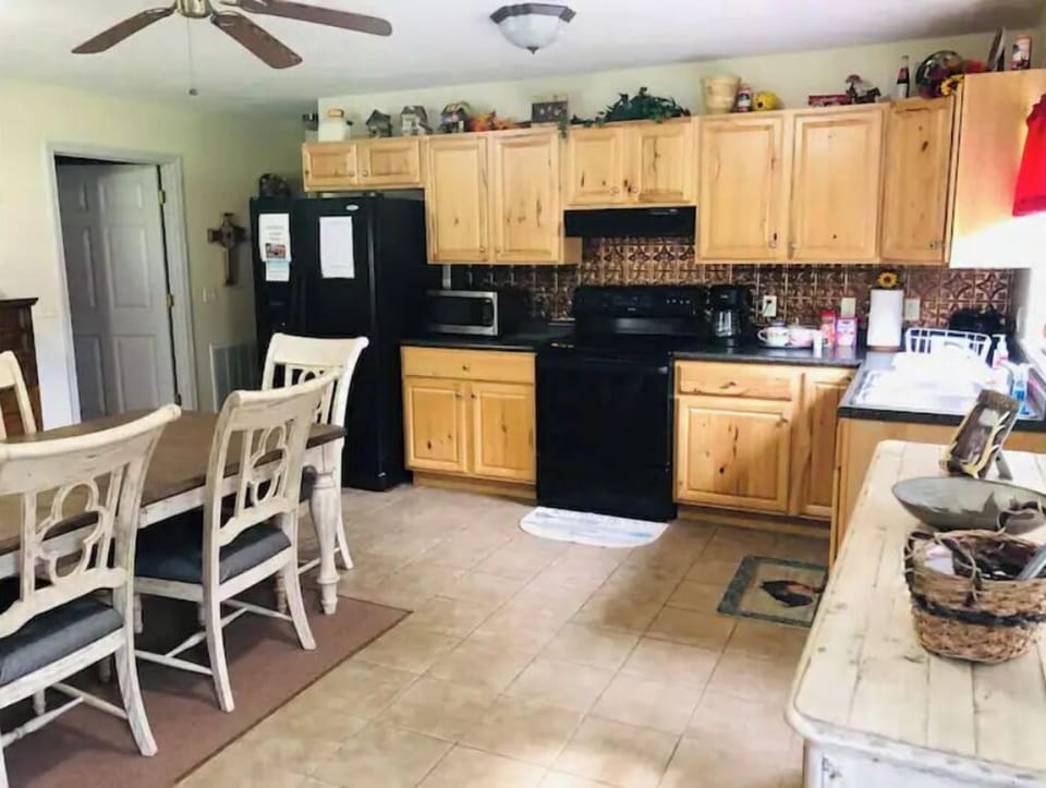 Cook a big family dinner or use the charcoal grill outside under the carport.