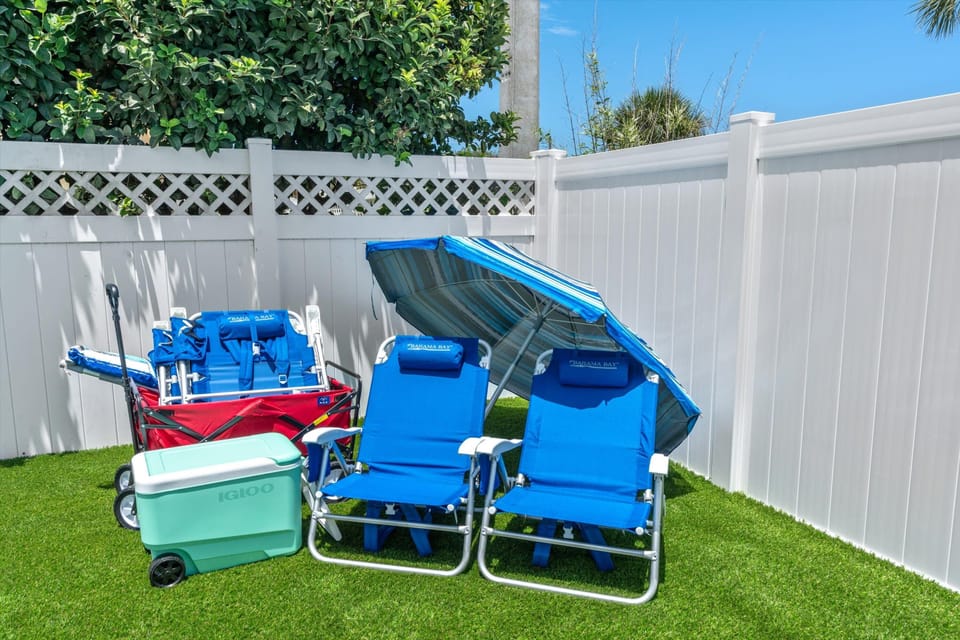 8 beach chairs, rolling cooler, beach cart and umbrella