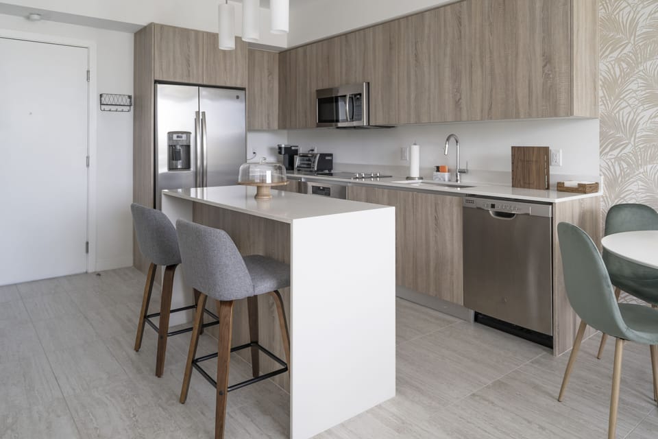 Fully equipped kitchen with modern appliances and sleek design.