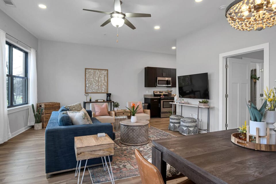 Large living room with Queen pullout couch, dining table with seating for 6, HD TV with YouTube TV for cable and all the apps you could want plus a walkout private patio with seating for 2.