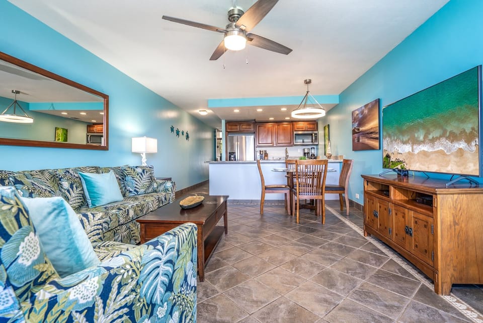 Picture yourself relaxing in this airy, tropical-inspired space where cool ocean breezes and vibrant island colors welcome you home after a day of adventure.