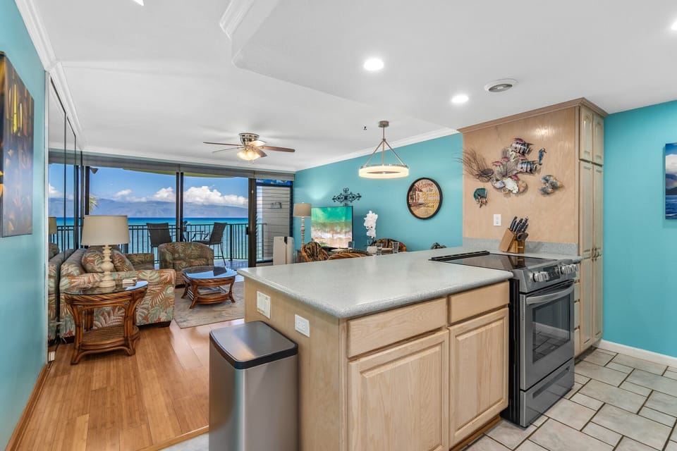 Ocean views greet you from this bright, open-plan living space where the kitchen flows seamlessly into the cozy lounge.