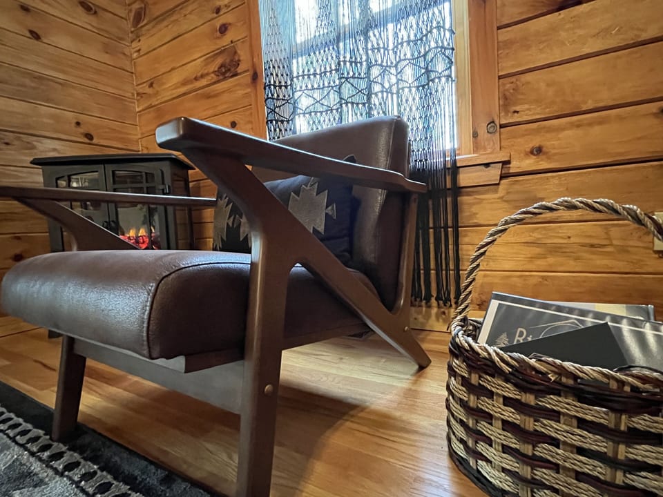 The basket next to the arm chair houses a guest book & the Guide to RiverHouse.