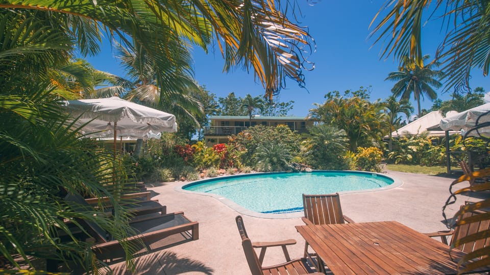 View of Villa Ta'i, from across the pool, top floor of the colonial style house