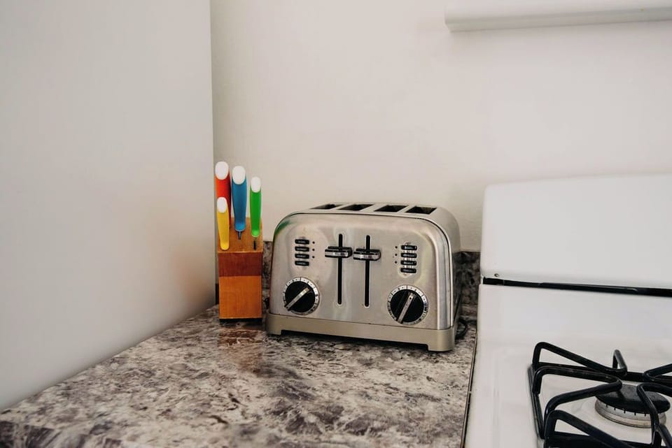 Kitchen has all the amenities for eating in.