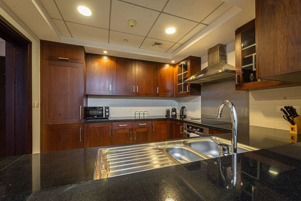 Kitchen: Stylish elegance awaits in this fully equipped kitchen, perfect for culinary adventures!