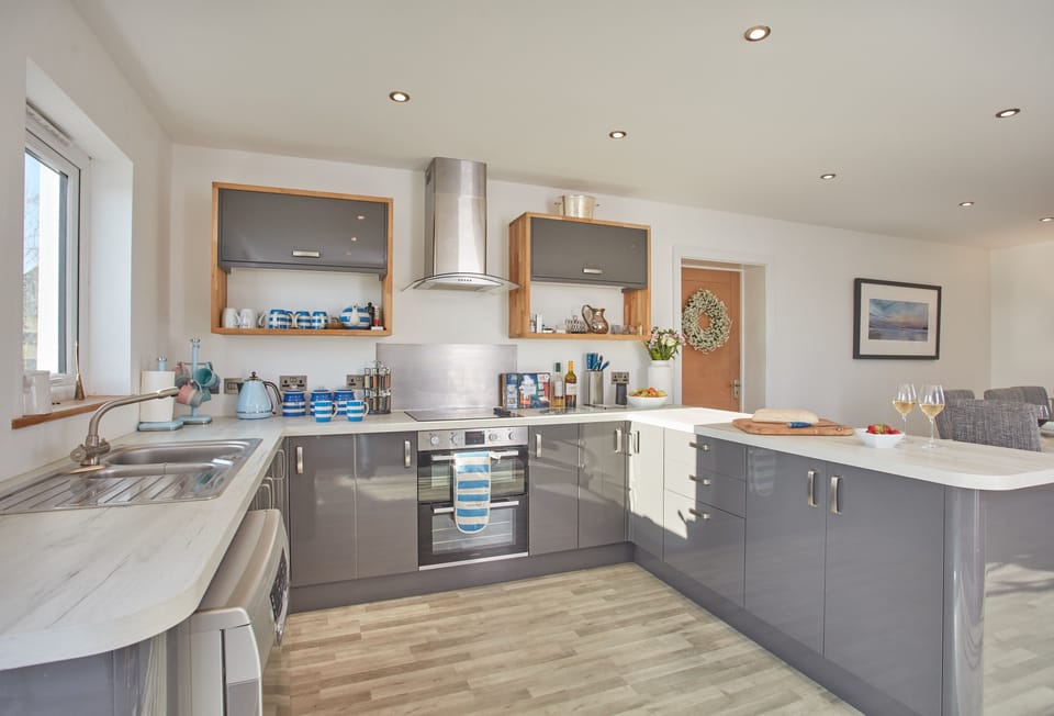Treveth Lowen, St Minver. Ground floor: Kitchen with American style fridge/freezer, dishwasher and french doors to outside