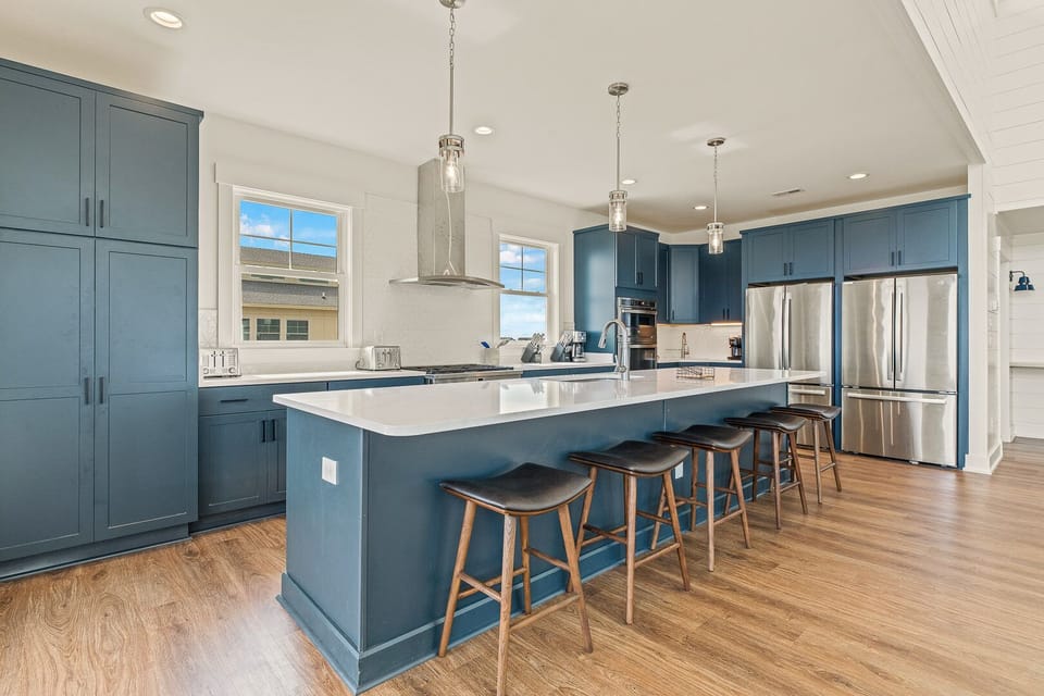 Kitchen with Bar Stool Seating on Third Level