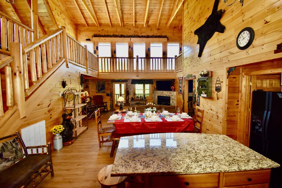 One of a kind open concept log cabin blessed with tons of sunlight