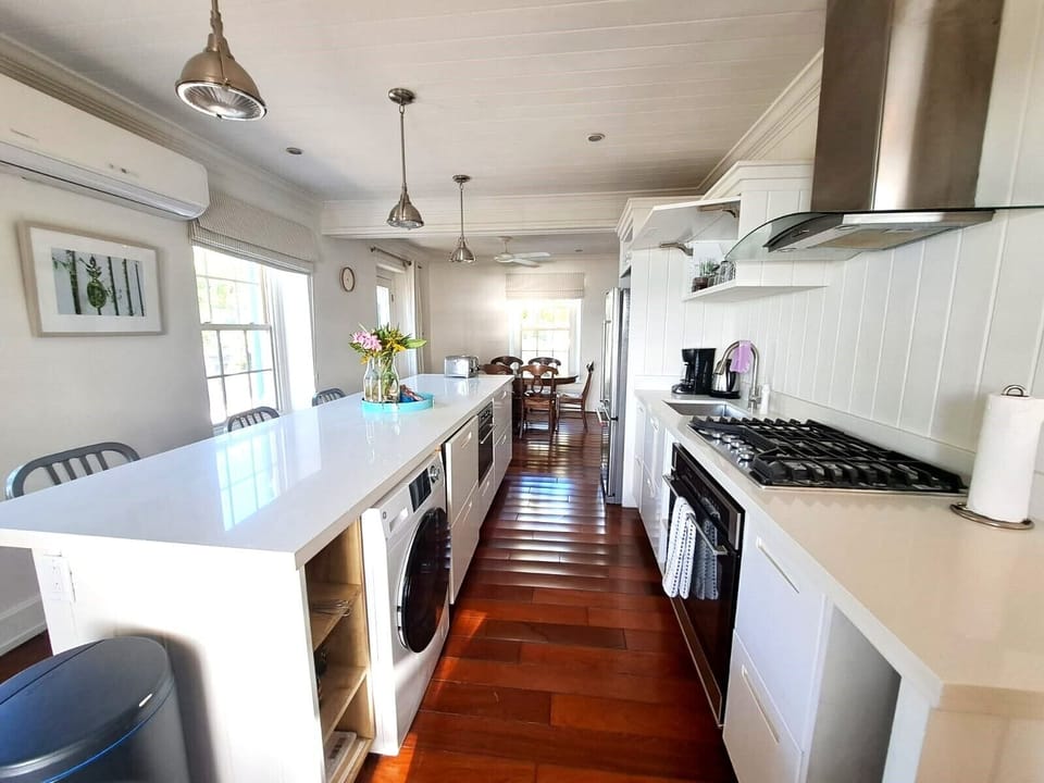 Fully equipped kitchen with modern appliances and ample counter space.