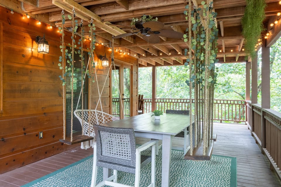 Hang out and snap some pics on the outdoor dining table with hanging swings