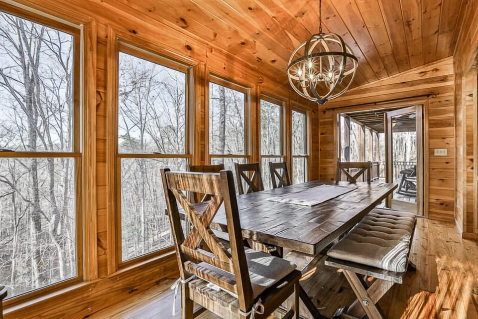 The dining table has a full view of nature.