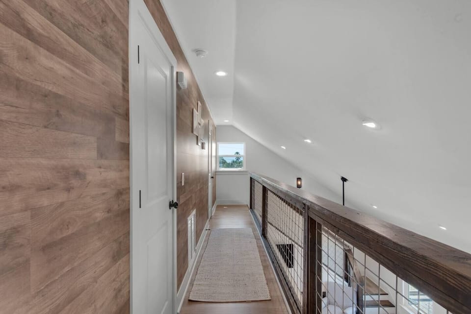 Warm wood accents add character and coastal sophistication.