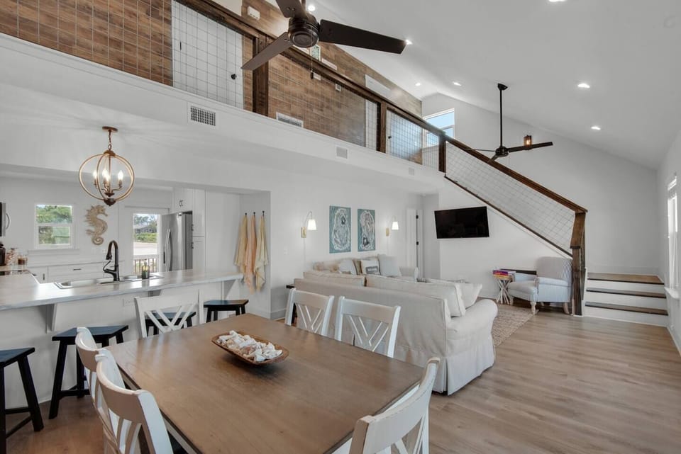 Bright open-concept living with soaring coastal charm.