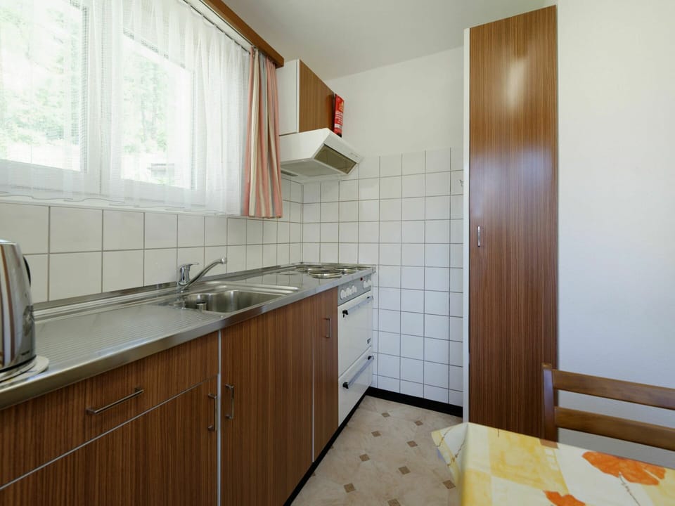 Cabinetry, Tap, Kitchen Sink, Sink, Countertop, Property, Furniture, Plumbing Fixture, Window, Building