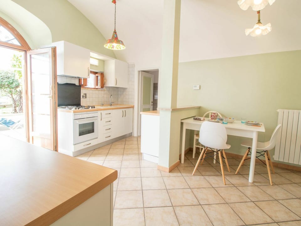 Furniture, Cabinetry, Countertop, Exhaust Hood, Kitchen, Table, Lighting, Chair, Wood, Kitchen Stove