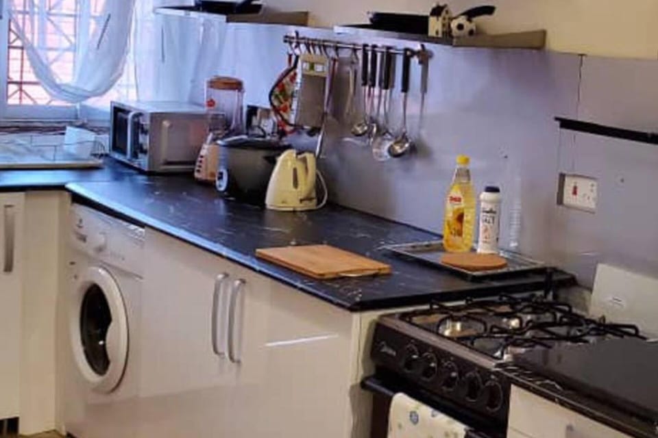 Open kitchen, rice cooker, blender, toaster, microwave, kettle Nespresso coffee maker.