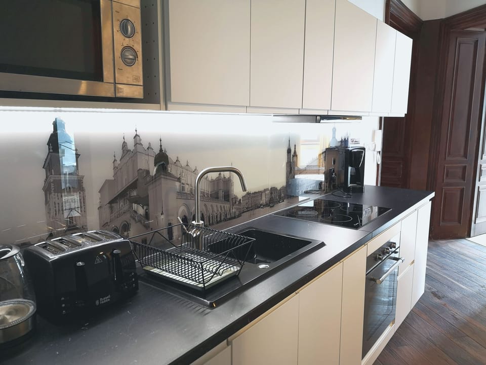 Kitchen is fully equipped with all necessary kitchenware.