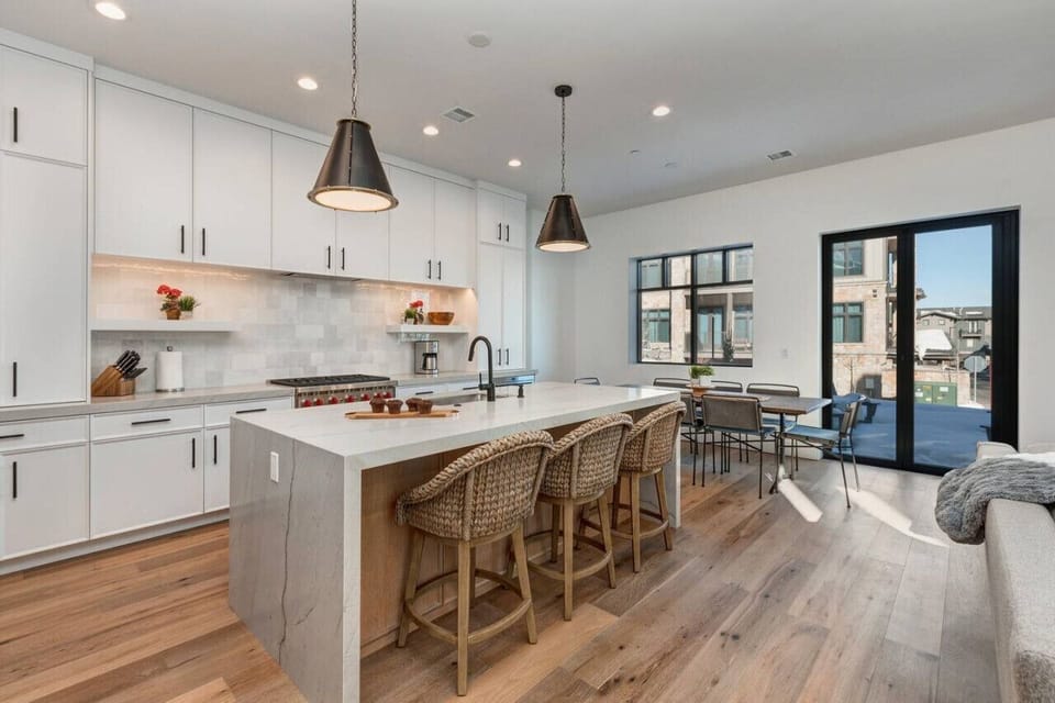 Gourmet Kitchen with large island seating for 8 in the dining room