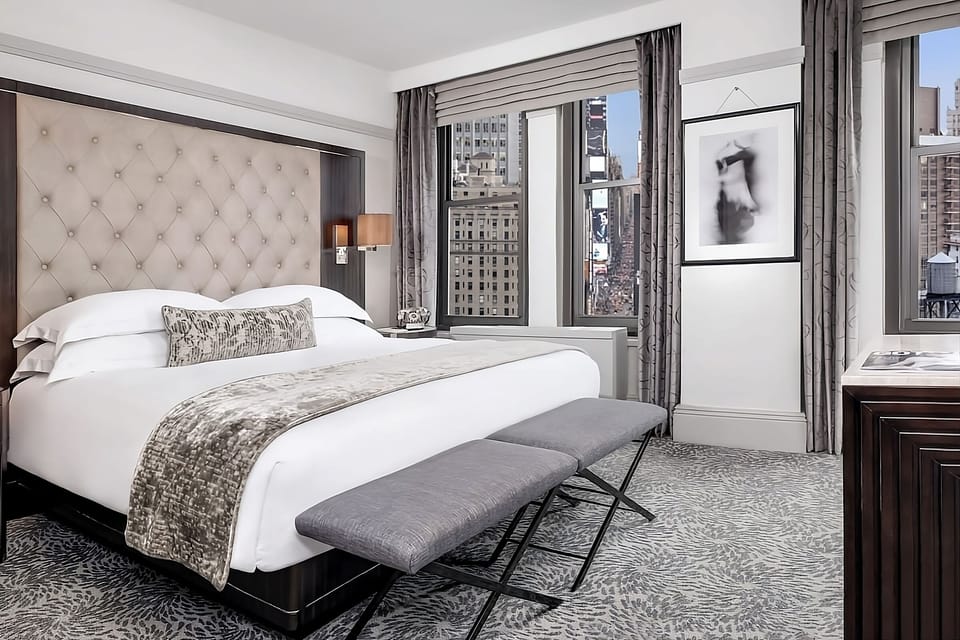 Wake up to iconic city views from a luxurious king bed.