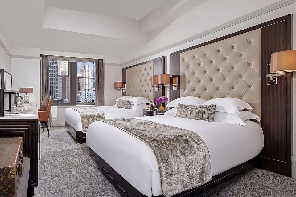 Stretch out together in two plush beds with airy space.