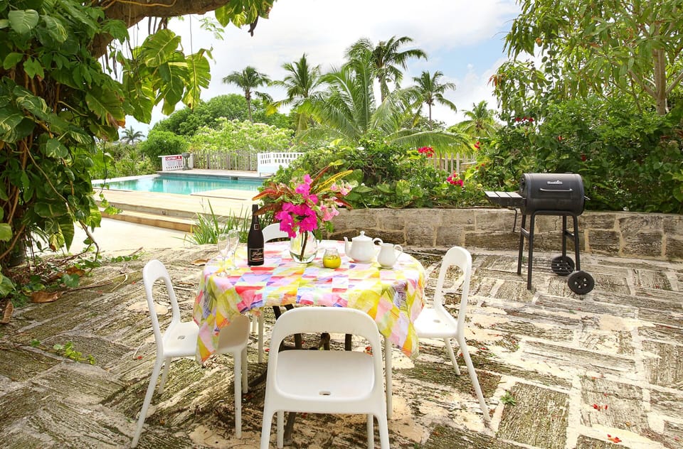 Outdoor dining area with seating for 4. 