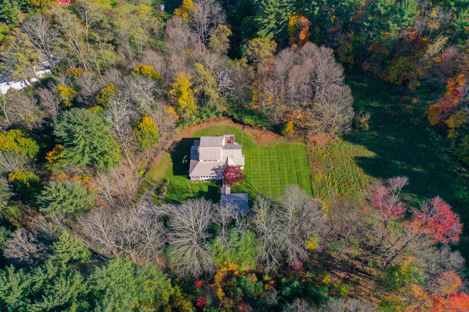 House with connecting ramp to garage on 5 acres. Private, yet a lot to walk to.